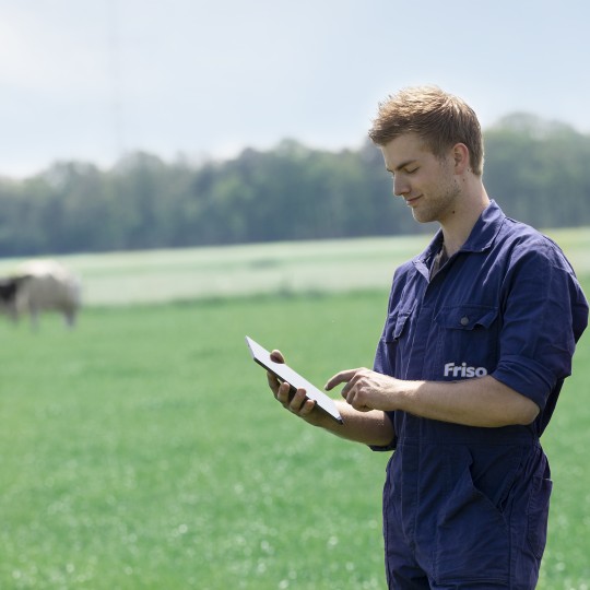 Farmer tracking cow's health
